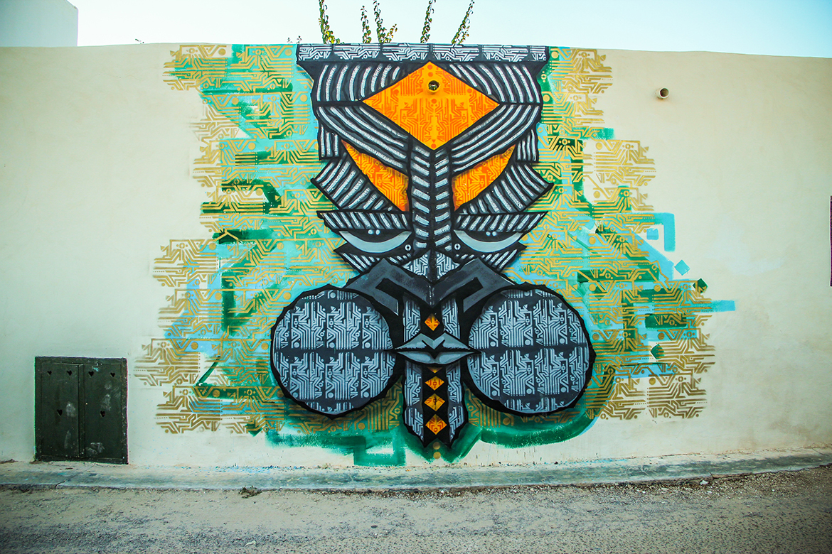 A mural for the Itinerrance Gallery's 2013 Djerbahood open-air museum project in the village of Erriadh, Djerba, Tunisia. A mural for the Itinerrance Gallery's 2013 Djerbahood open-air museum project in the village of Erriadh, Djerba, Tunisia.